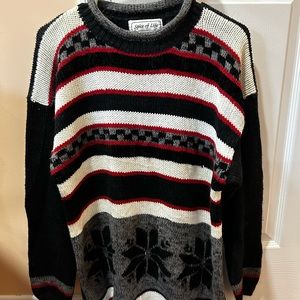 This is a Spice Of Life knit sweater with an oversized fit in a size small
